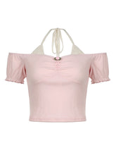 Top abullonado con encaje floral de Cecilia